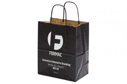 Carrying bag in black paper with print - medium